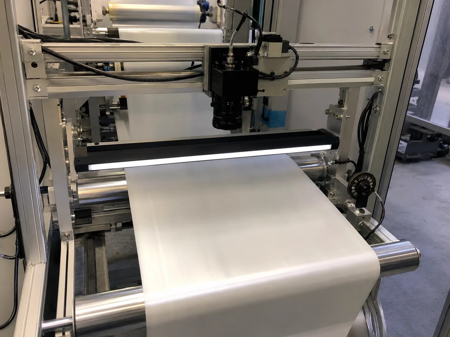 Roll-to-roll web defect inspection line with line scan camera